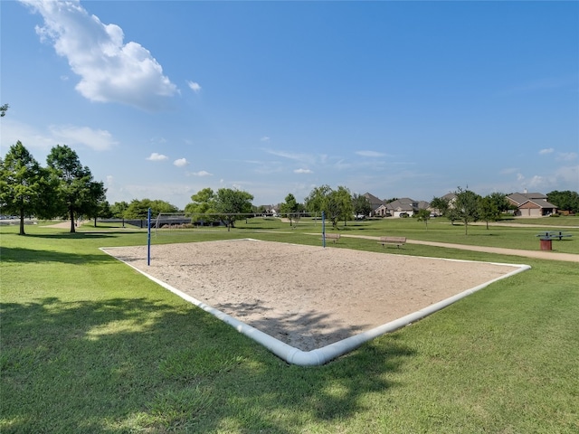 surrounding community featuring a yard and volleyball court