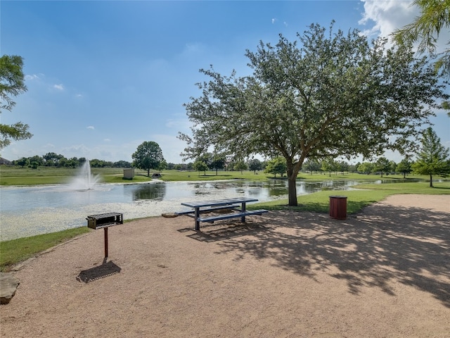 surrounding community featuring a water view