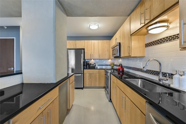 800 Brazos St Unit 702, Austin, TX 78701 - kitchen with appliances with stainless steel finishes, a sink, decorative backsplash, light brown cabinetry, and dark stone counters