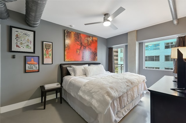 bedroom with concrete flooring and ceiling fan