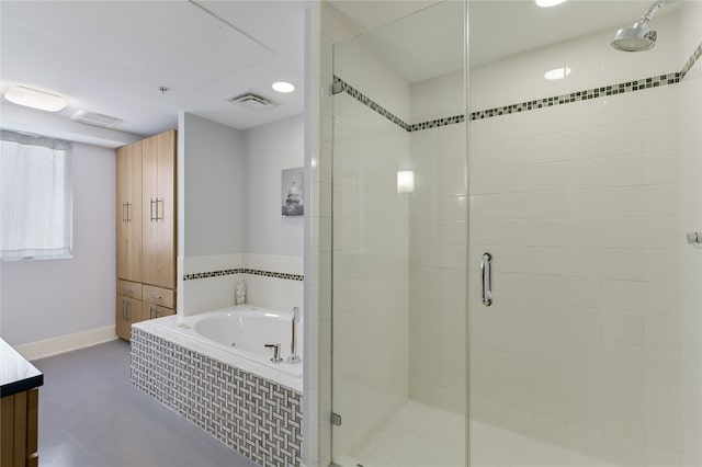 bathroom with vanity, concrete floors, and separate shower and tub