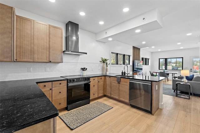 kitchen featuring wall chimney exhaust hood, sink, kitchen peninsula, electric range, and stainless steel dishwasher