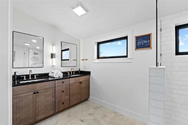 bathroom with walk in shower and vanity