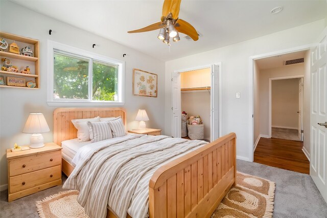 carpeted bedroom featuring a closet and ceiling fan