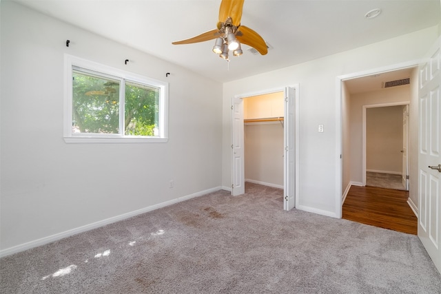 unfurnished bedroom with a closet, ceiling fan, and light colored carpet