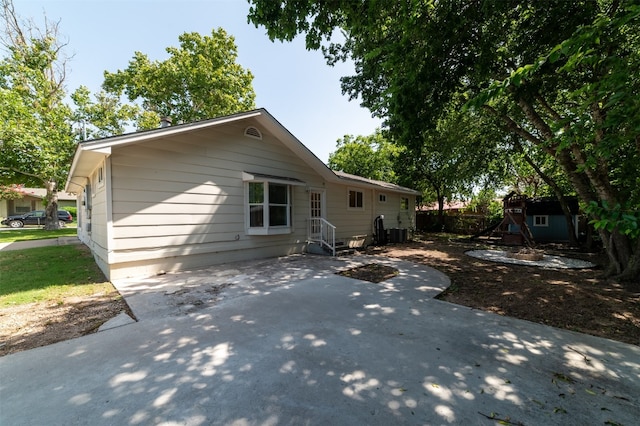 back of house featuring a patio area and central AC unit