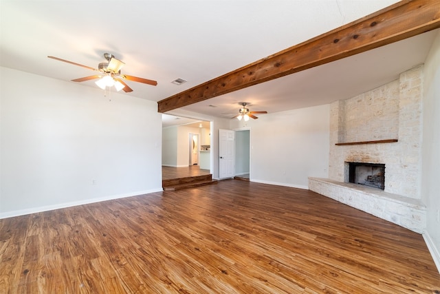 unfurnished living room with hardwood / wood-style floors, a fireplace, and ceiling fan