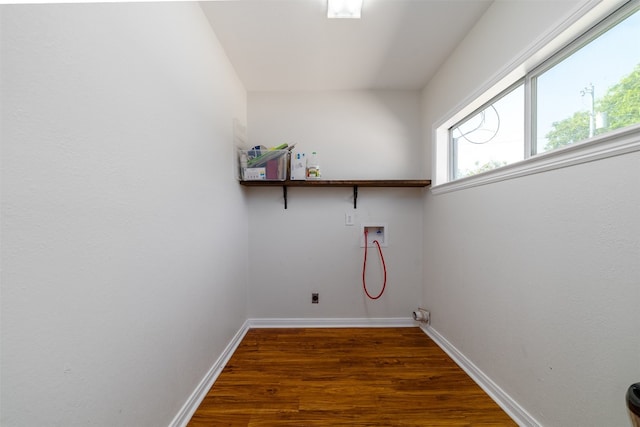 laundry area with hookup for an electric dryer, hookup for a washing machine, and dark hardwood / wood-style floors