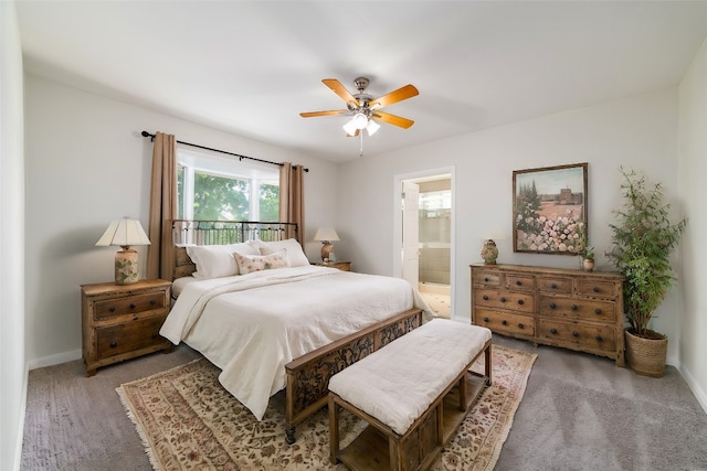 carpeted bedroom featuring ensuite bathroom and ceiling fan