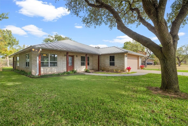 ranch-style house featuring a garage and a front lawn