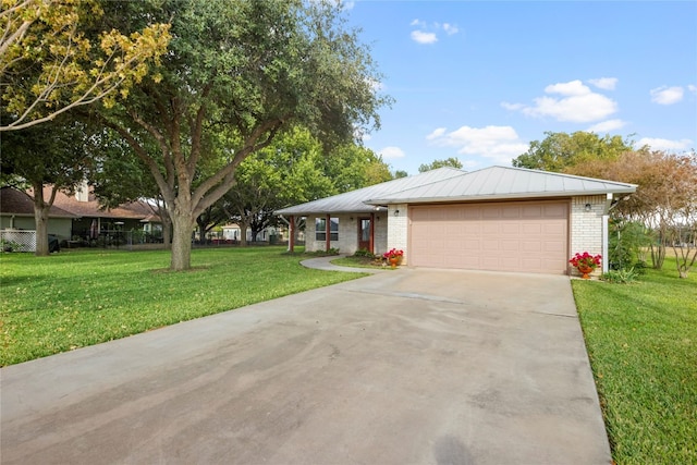 ranch-style home featuring a garage and a front yard