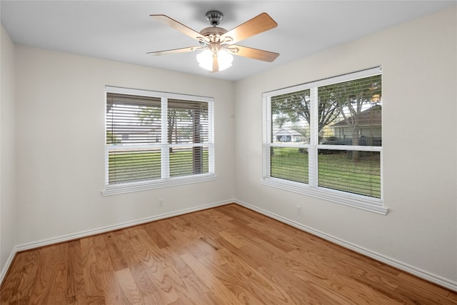 empty room featuring ceiling fan and light hardwood / wood-style floors