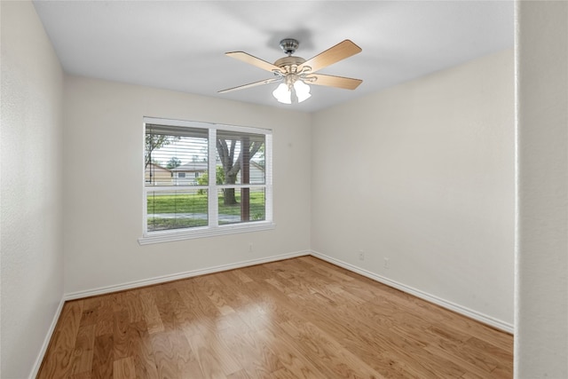 empty room featuring ceiling fan and light hardwood / wood-style floors