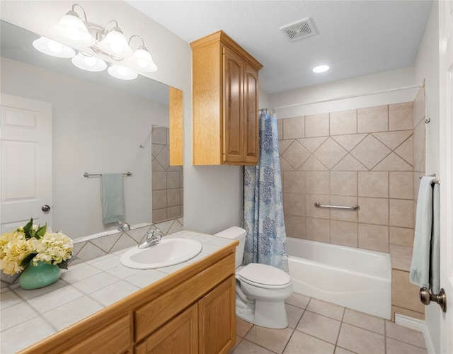 full bathroom featuring tile patterned floors, vanity, toilet, and shower / bath combo