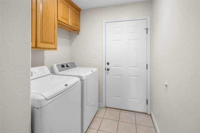 116 Wren St, Highland Haven, TX 78654 - washroom with washer and dryer, cabinet space, light tile patterned flooring, and baseboards
