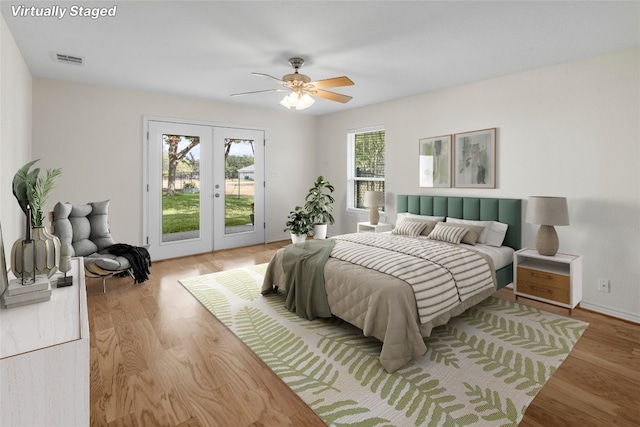 bedroom with ceiling fan, access to exterior, french doors, and light hardwood / wood-style flooring