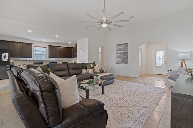 1336 Twin Estates Dr, Kyle, TX 78640 - living area featuring arched walkways, plenty of natural light, a ceiling fan, light tile patterned floors, and recessed lighting