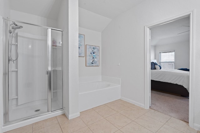 1336 Twin Estates Dr, Kyle, TX 78640 - ensuite bathroom with a stall shower, tile patterned flooring, a bath, and baseboards
