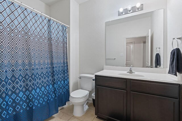 1336 Twin Estates Dr, Kyle, TX 78640 - bathroom featuring toilet, tile patterned flooring, vanity, and a shower with curtain
