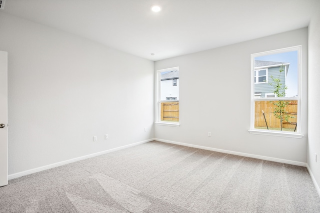 unfurnished room with carpet flooring