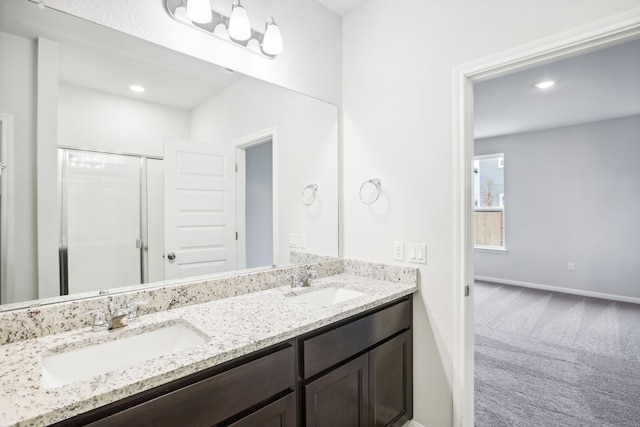 bathroom with vanity and an enclosed shower