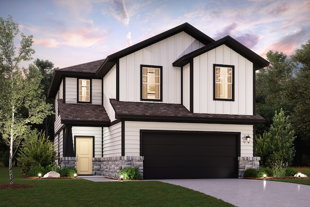 view of front of home featuring a garage and a lawn