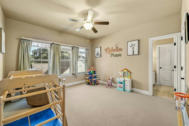 bedroom with ceiling fan and light colored carpet