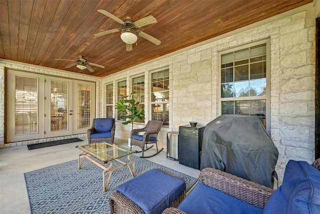 view of patio with area for grilling, ceiling fan, and french doors