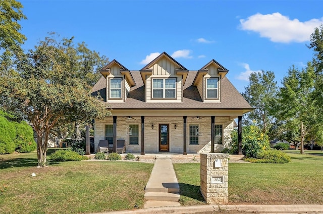 view of front of house with a porch and a front lawn