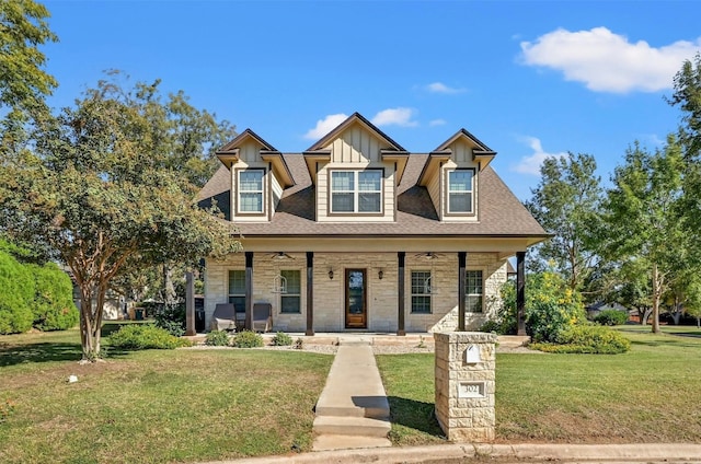 302 Columbine St, Marble Falls, TX 78654 - view of front of home with a porch, stone siding, a front yard, and ceiling fan