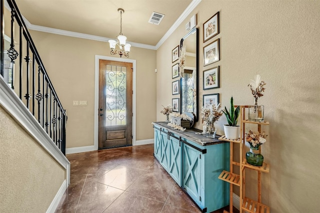 foyer with a notable chandelier and ornamental molding