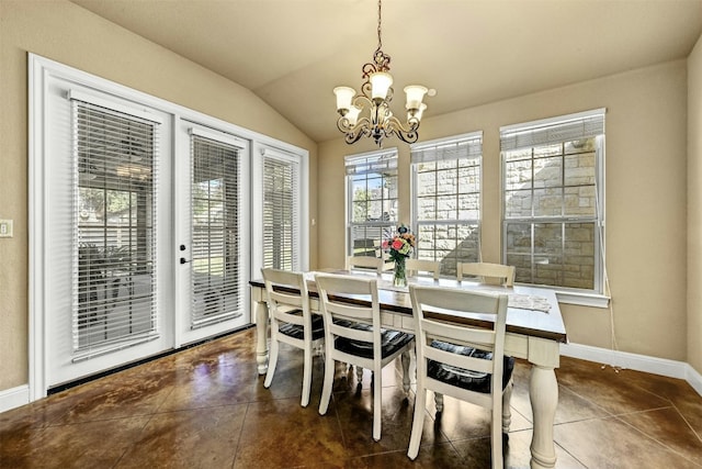 tiled dining room with an inviting chandelier and vaulted ceiling