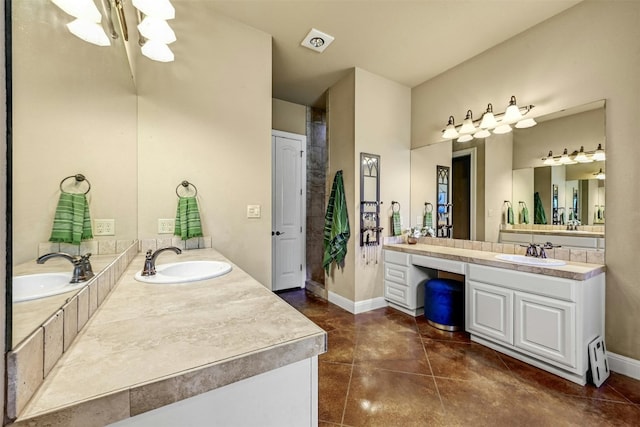 bathroom featuring tile patterned floors and vanity