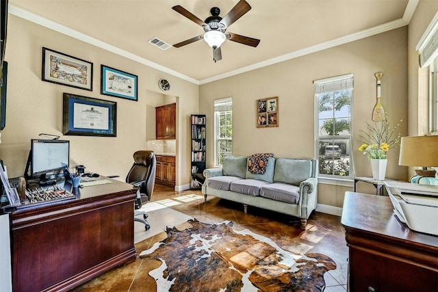 office with ornamental molding, ceiling fan, and a healthy amount of sunlight