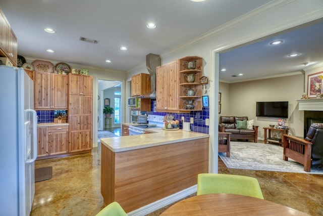 kitchen featuring ornamental molding, kitchen peninsula, stainless steel appliances, and tasteful backsplash