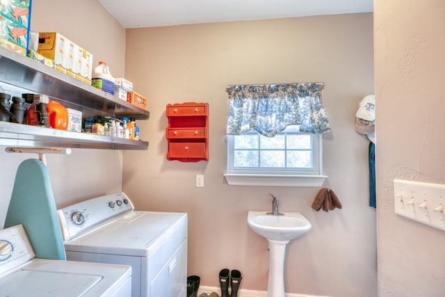 laundry area featuring washing machine and clothes dryer