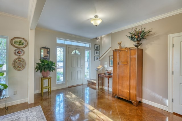 entryway featuring a wealth of natural light and crown molding