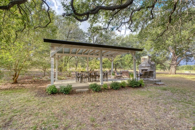 exterior space with a lawn, a gazebo, and a patio area