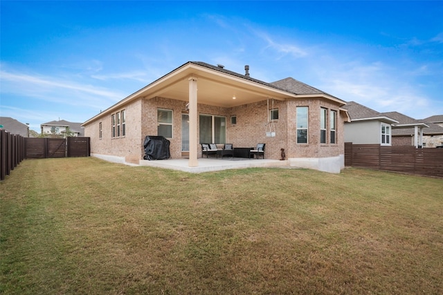 back of house with a patio, an outdoor hangout area, and a yard