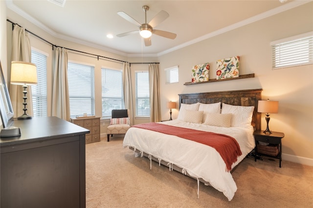 carpeted bedroom with crown molding, multiple windows, and ceiling fan