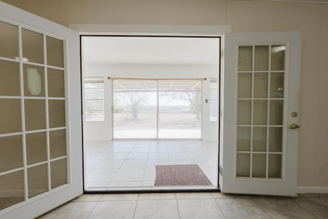 entryway featuring light tile patterned floors