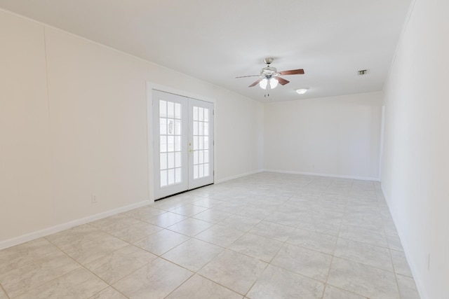 unfurnished room with french doors, light tile patterned flooring, and ceiling fan