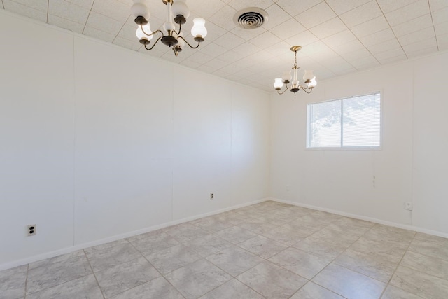 unfurnished room featuring a notable chandelier