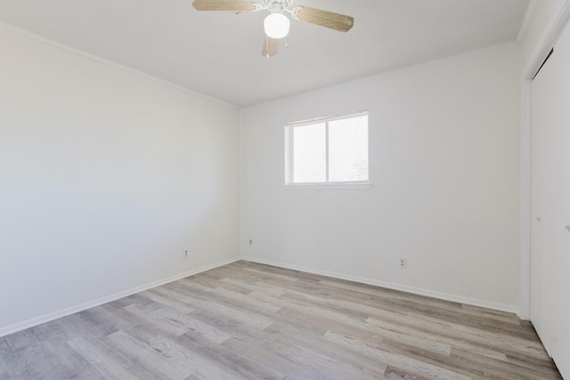 unfurnished room featuring ceiling fan, crown molding, and light hardwood / wood-style flooring