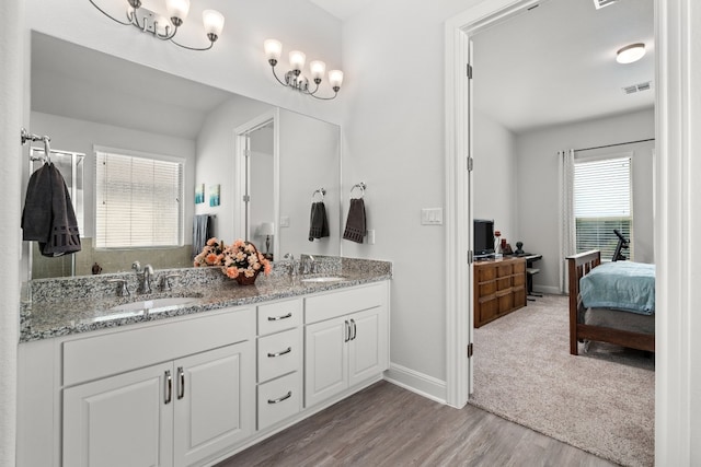 bathroom featuring vanity and hardwood / wood-style flooring