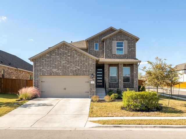 front of property featuring a front yard and a garage