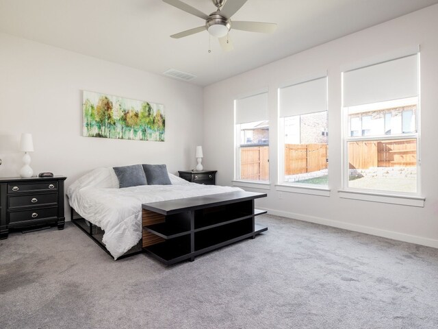 carpeted bedroom featuring ceiling fan