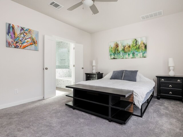 bedroom with carpet floors, connected bathroom, and ceiling fan