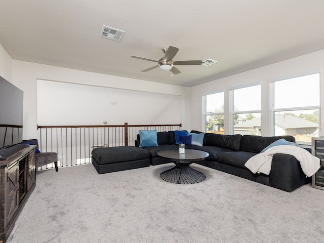 living room with ceiling fan and carpet flooring