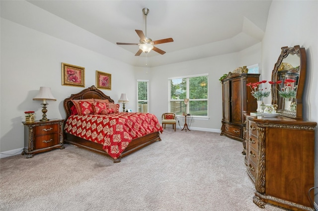 bedroom with ceiling fan and light carpet